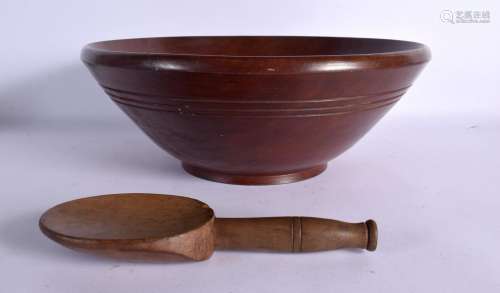 A VINTAGE TREEN BOWL and butter pat. Largest 32 cm diameter....