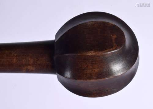 A TRIBAL CARVED WOOD THROWING CLUB. 77 cm long.
