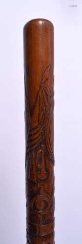 A 19TH CENTURY CONTINENTAL CARVED WOOD WALKING CANE decorate...