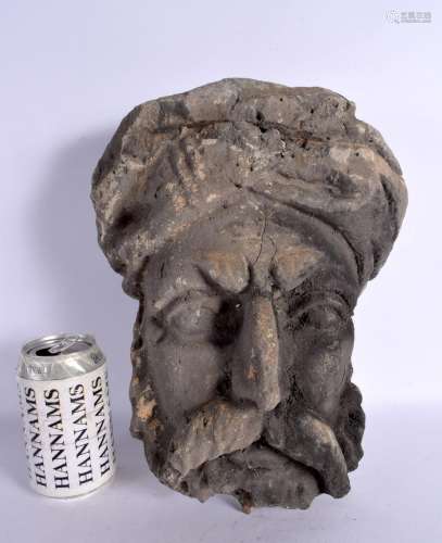 A LARGE 19TH CENTURY CONTINENTAL CARVED STONE MASK HEAD OF A...