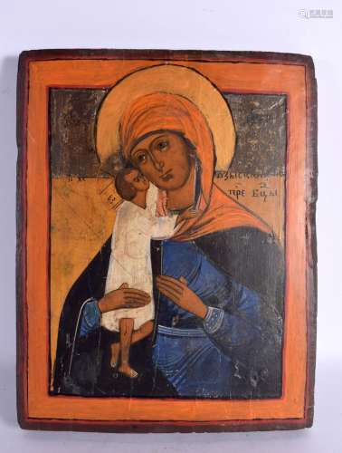 A RUSSIAN CARVED WOOD ICON. 30 cm x 25 cm.