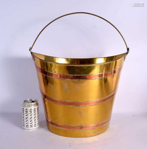 A GEORGE III COPPER AND BRASS BUCKET. 54 cm x 38 cm inc hand...