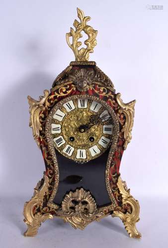 AN ANTIQUE BOULLE TORTOISESHELL MANTEL CLOCK decorated with ...