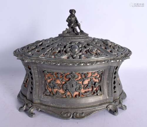 AN ANTIQUE GERMAN PEWTER CASKET AND COVER with figural termi...