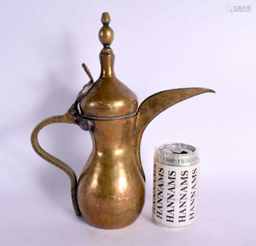 AN ANTIQUE TURKISH MIDDLE EASTERN BRONZE ISLAMIC COFFEE POT....