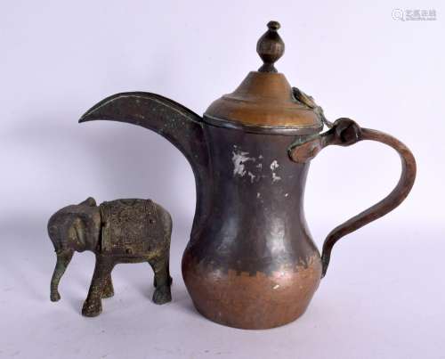 A MIDDLE EASTERN OMANI TYPE BRASS EWER together with an Indi...