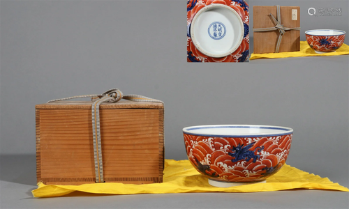 A BLUE AND WHITE IRON RED GLAZED WAVE AND BEAST BOWL