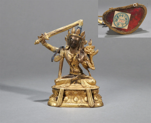 A GILT BRONZE STATUE OF MANJUSHRI