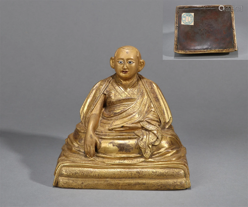 A GILT BRONZE STATUE OF GURU