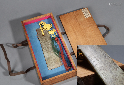 AN ANCIENT JADE AXE WITH QIANLONG'S INSCRIPTION