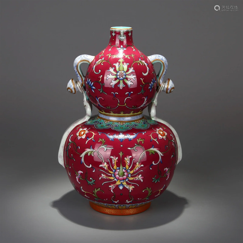 A ROUGE-RED GROUND FAMILLE ROSE INTERLOCKING LOTUS PATTERN R...