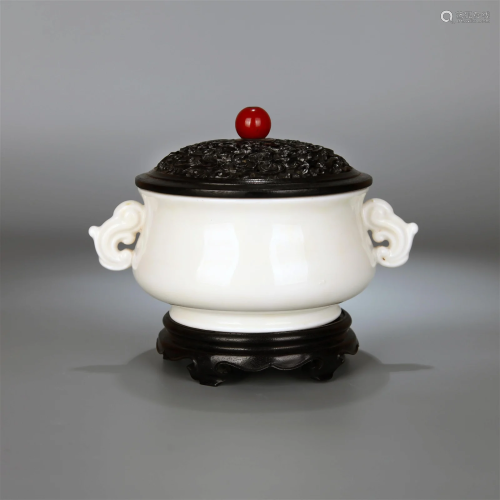 A DEHUA KILN DOUBLE-EARED CENSER WITH SANDALWOOD LID AND STA...