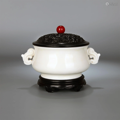 A DEHUA KILN DOUBLE-EARED CENSER WITH SANDALWOOD LID AND STA...