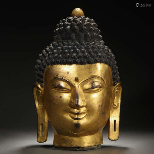 A Tibetan Bronze-gilt Buddha Head