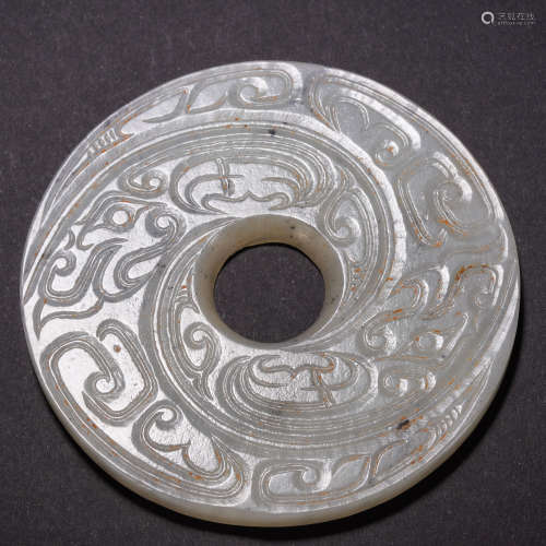 A Chinese Carved White Jade Disc Bi