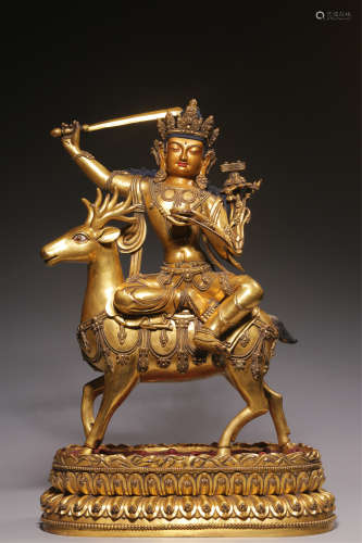 Bronze gilt statue of Manjusri Bodhisattva riding a deer fro...