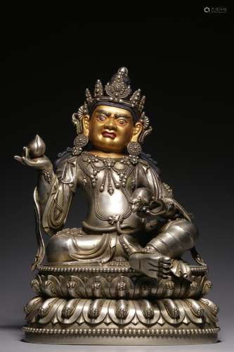 Sitting statue of the God of Wealth in silver mud and gold f...