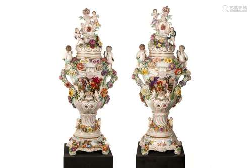 PAIR OF MONUMENTAL GERMAN PORCELAIN ARMORIAL URNS