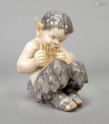 Sitting faun, playing a pan flute,