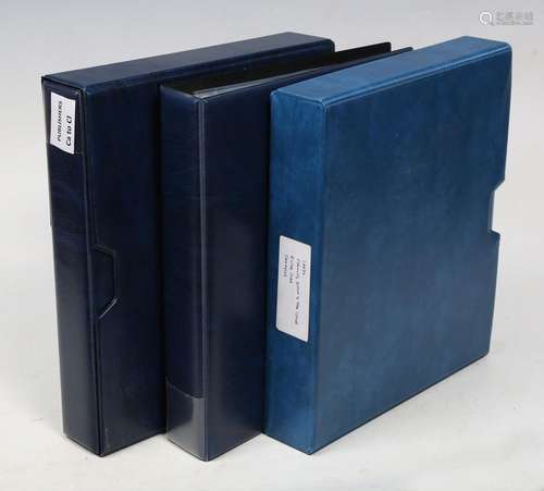 ALBUMS. A collection of approximately 31 blue postcard album...