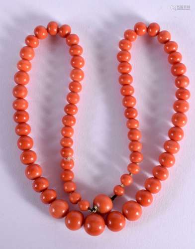 A CORAL NECKLACE. Length 57cm, bead size 937mm, weight 75g