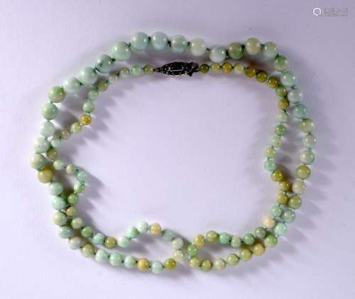 A GRADUATED JADE NECKLACE WITH SILVER MOUNTS. Stamped 935, l...