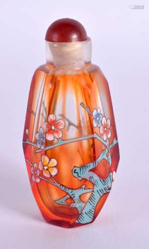 A CHINESE AMBER GLASS SNUFF BOTTLE WITH ENAMEL FLORAL DECORA...