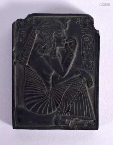 A STONE PLAQUE ENGRAVED WITH A SEATED PHARAOH AND HIEROGLYPH...
