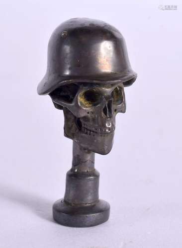 A BRONZE ARMY SKULL PIPE TAMPER. 4.5 cm x 2.5 cm.