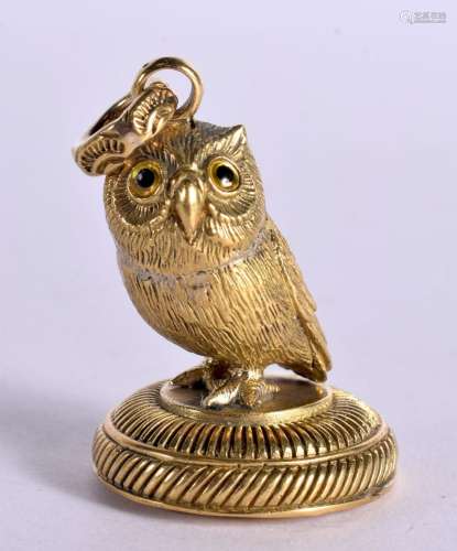 A BRASS OWL PENDANT. 23 grams. 3.75 cm x 2.75 cm.