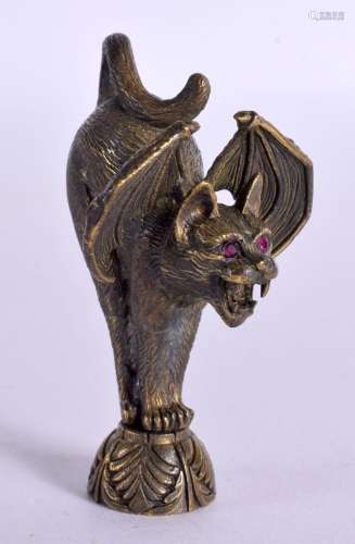 A BRASS GOTHIC CAT PIPE TAMPER. 6.5 cm x 3.5 cm.