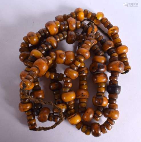 THREE MIDDLE EASTERN AMBER TYPE PRAYER NECKLACES. 545 grams....