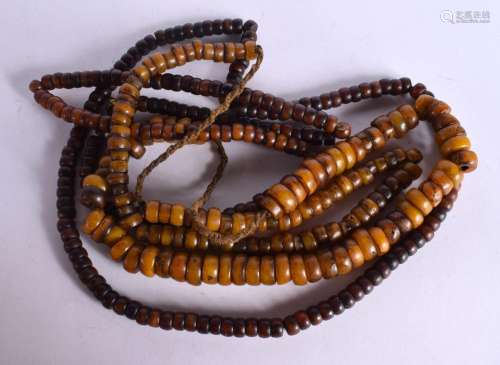 FOUR MIDDLE EASTERN AMBER TYPE PRAYER NECKLACES. 441 grams. ...