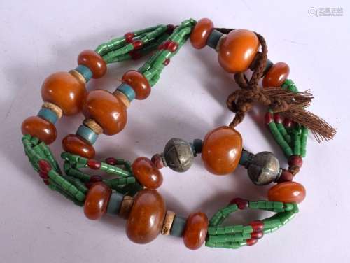 A LARGE MIDDLE EASTERN AMBER TYPE NECKLACE. 323 grams. 110 c...