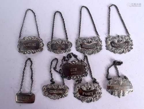A GROUP OF SILVER DECANTER LABELS. London 1821 to 1926. 130 ...