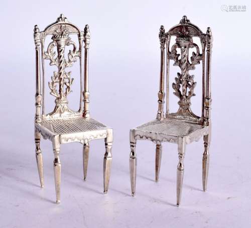 A PAIR OF DUTCH SILVER CHAIRS. 54 grams. 2.6 cm x 7.5 cm.