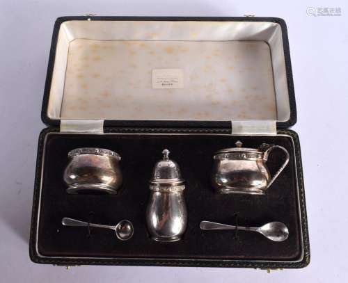 A CASED SILVER CONDIMENT SET. Birmingham 1966. Weighable sil...