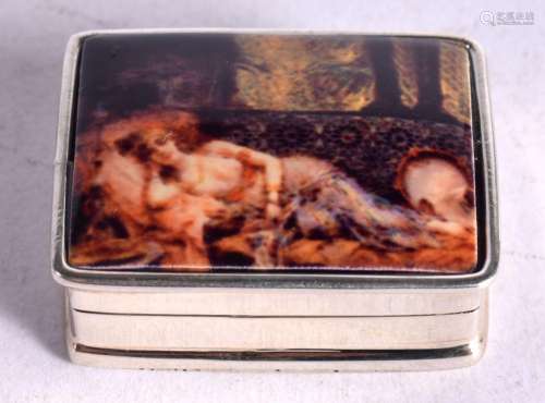 A SILVER PILL BOX WITH A SCANTILY CLAD WOMAN ON THE LID. Sta...