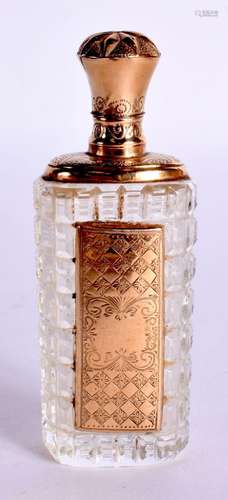 A GOLD TOPPED SCENT BOTTLE. 8.7cm x 3.2cm x 2.4cm, weight 48...