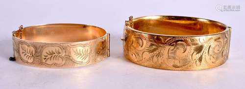 TWO ROLLED GOLD BANGLES. Largest 6.3cm x 5.2cm internal, tot...