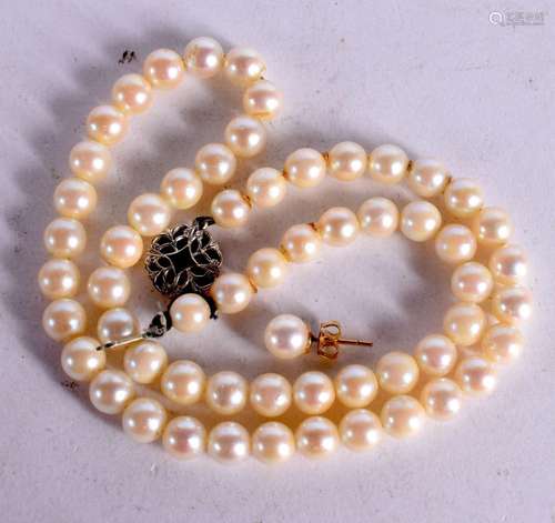 A CULTURED PEARL NECKLACE WITH 9CT GOLD CLASP. Stamped Birmi...