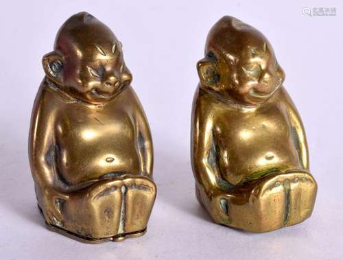 A PAIR OF CIRCA 1908 GERMAN BRASS BILLIKINS. 4.3cm x 2.7cm x...