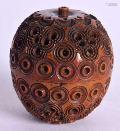 A CARVED COQUILLA NUT. 4.5cm x 4.1cm