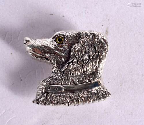 A SILVER DOGS HEAD BROOCH WITH GEM SET EYES. Stamped Sterlin...