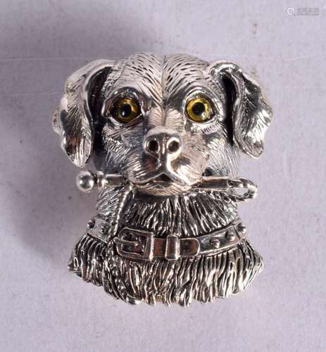 A SILVER DOGS HEAD BROOCH WITH GEM SET EYES. Stamped 925 Ste...