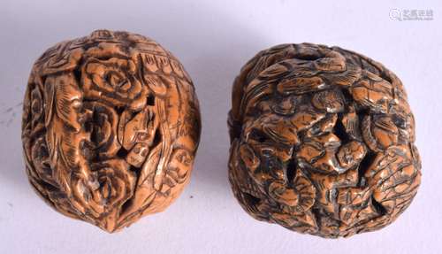 TWO CHINESE CARVED WALNUTS. 4cm x 4cm (2)