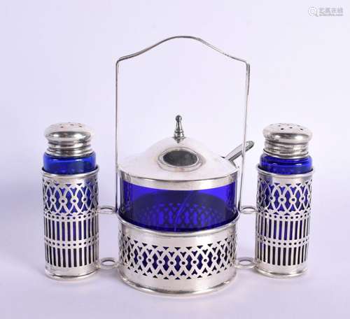 A SILVER CRUET SET WITH BLUE GLASS LINERS. Stamped Sterling,...