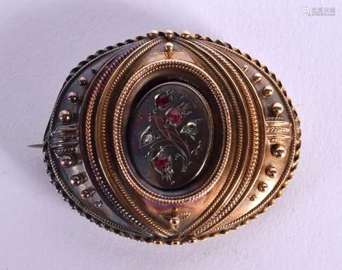 A 15CT GOLD MOURNING BROOCH INSER WITH RUBIES AND DIAMONDS. ...