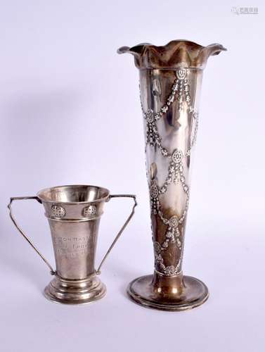 AN ART DECO TROPY SHAPED SILVER VASE TOGETHER WITH A LARGER ...