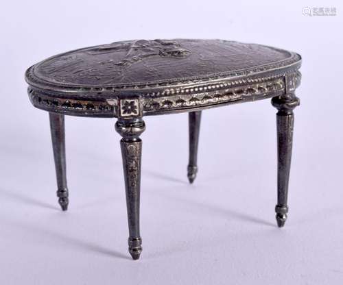 A CONTINENTAL SILVER MODEL OF A REGENCY TABLE EMBOSSED WITH ...